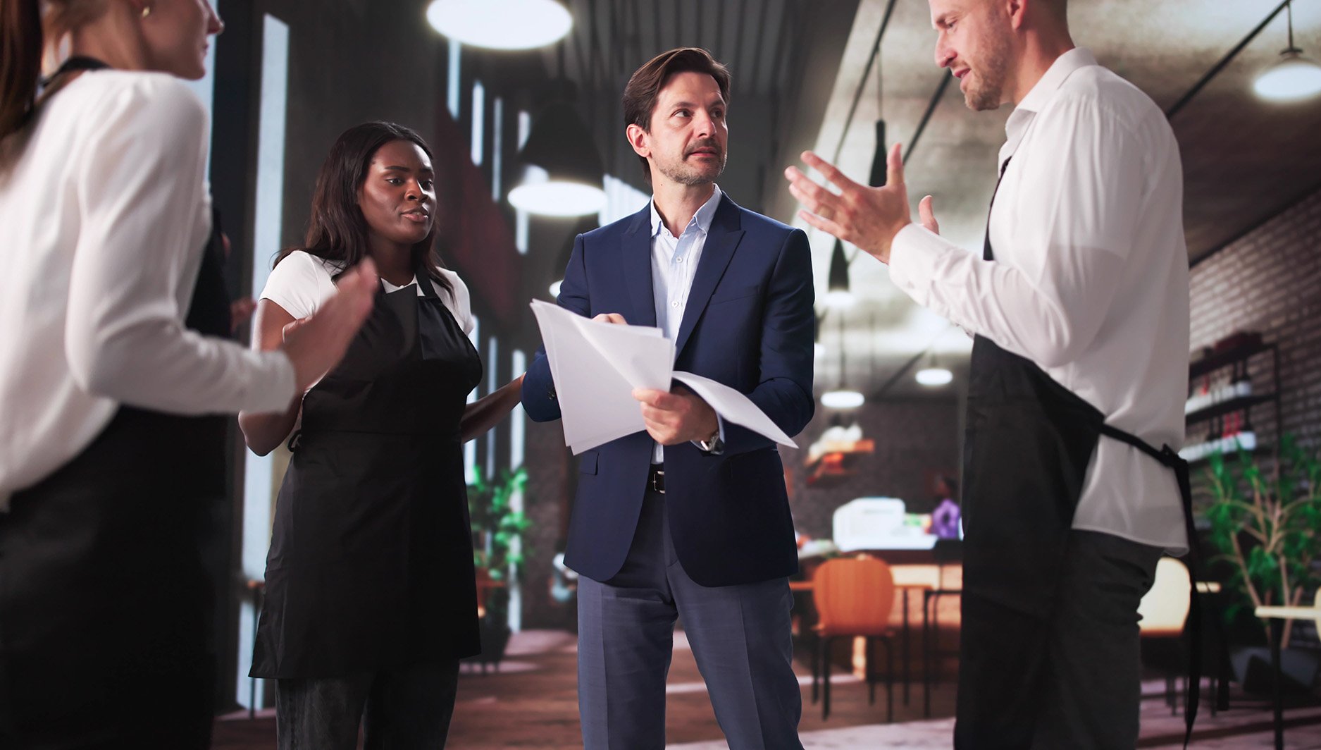 a manager has a discussion with three different employees.