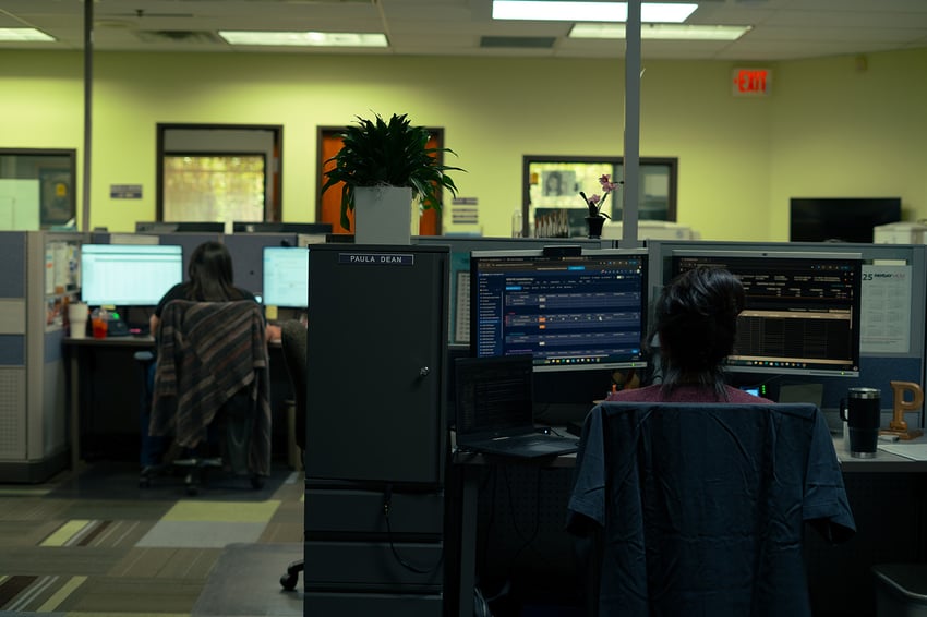 a payday hcm csr works with a client at their desk