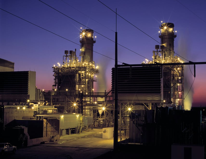 a-powerplant-with-the-sunset-in-the-background