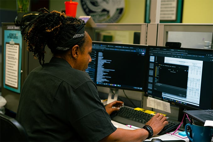 a payday hcm csr works with a client at their desk
