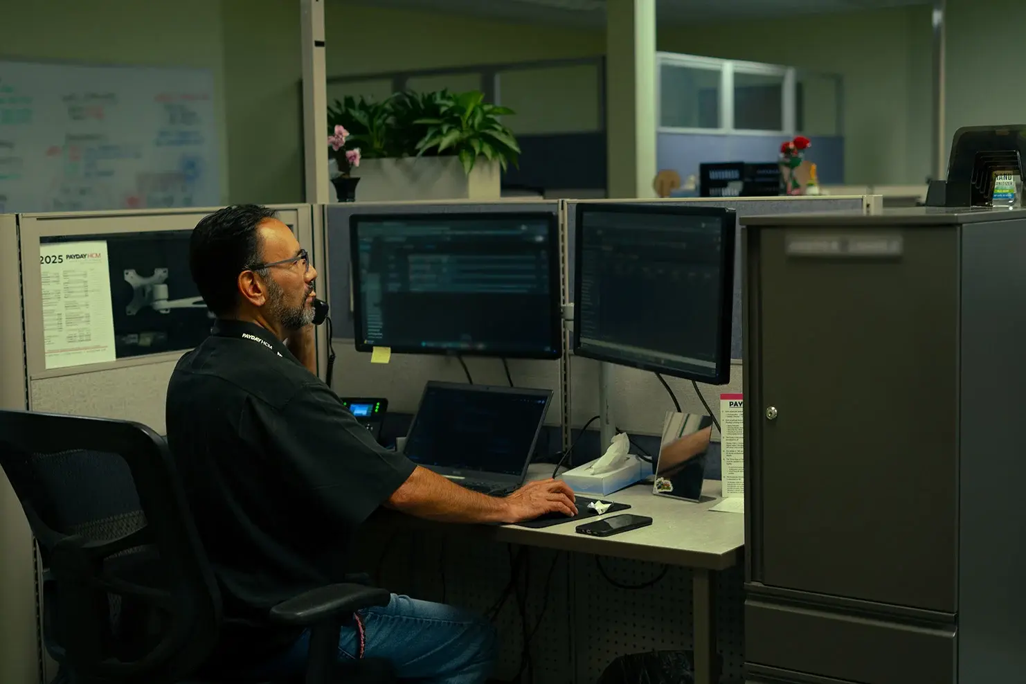 payday hcm client service representative working at their desk